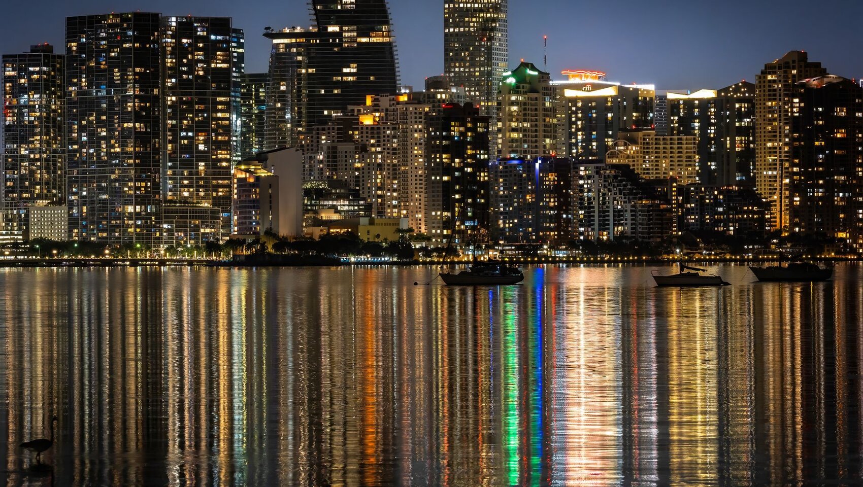 Miami skyline at night over the water