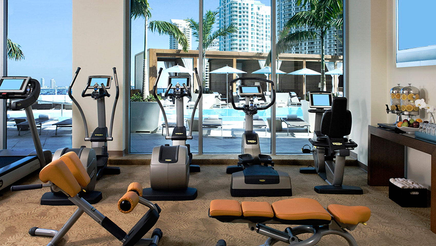 Fitness Center with exercise machines overlooking the pool