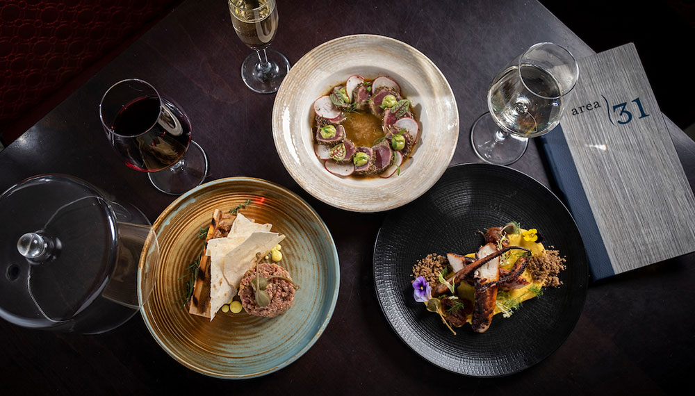 Varied dishes and beverages on table