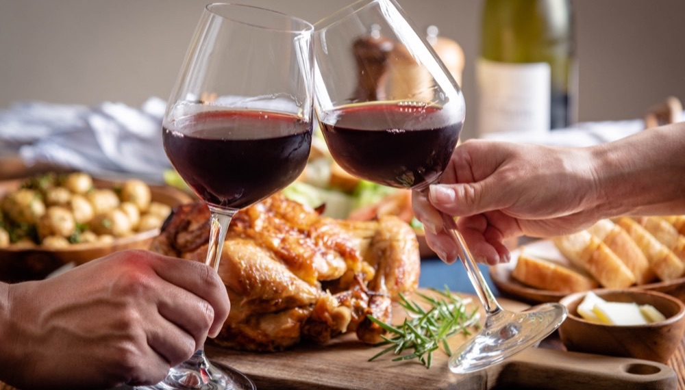 Glasses of wine in front of turkey dinner