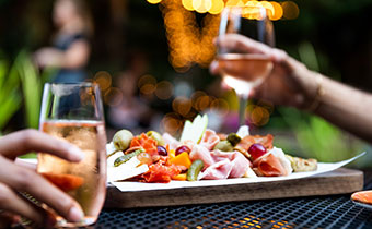 Glasses of wine and a charcuterie platter