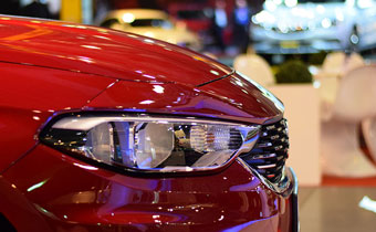 close up of the front of a red car