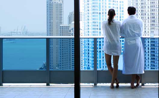 couple on Kimpton EPIC Hotel balcony