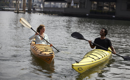 Kayakers on the water near Kimpton EPIC Hotel